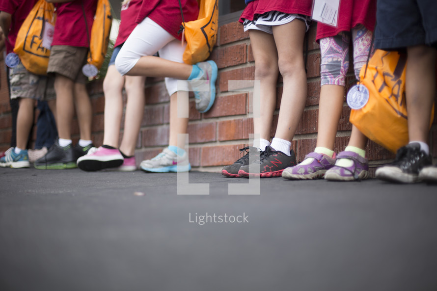 children waiting in a line 