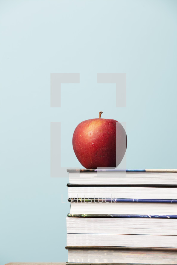 apple on a stack of books