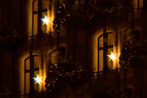 Christmas lights in a window at night 