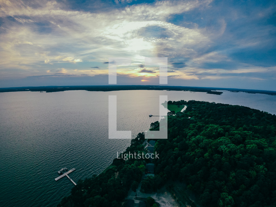 aerial view over docks on a lake 