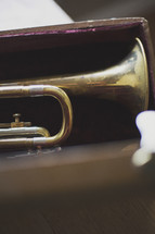 a shallow focus trumpet in case
