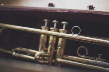 a shallow focus of a brass trumpet in case