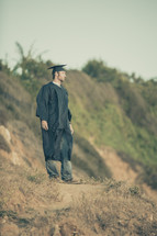 graduate standing outdoors