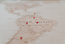 push-pins on a map of South America 
