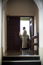 Priest in the sacristy.