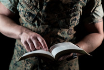 a marine reading a Bible 