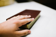 hand on a Bible 