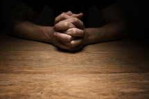 interlaced praying hands 