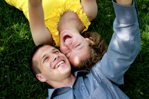 Couple laying in the grass.