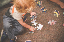 toddler building a puzzle 