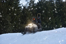 Snowmobiling Through Snowy Mountains at Twilight