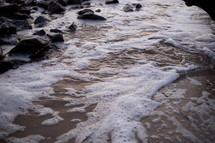 sea foam on a beach 