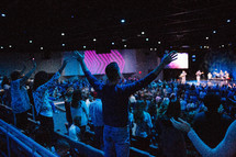 arms raised during a worship service 