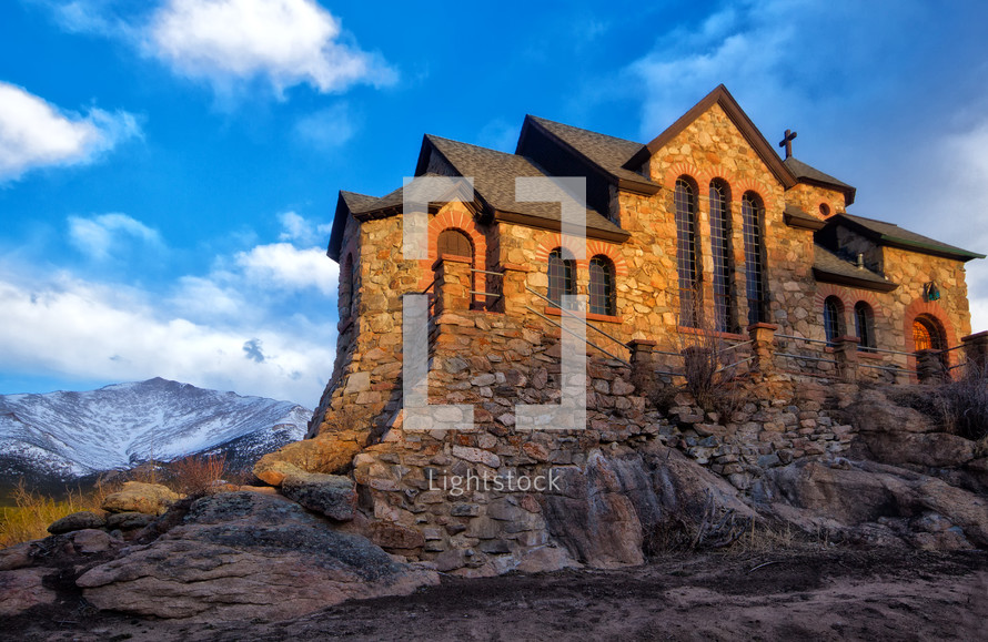 church built into rock on a mountainside 