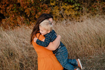 hug between a mother and toddler son