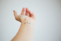 love tattoo on an arm 