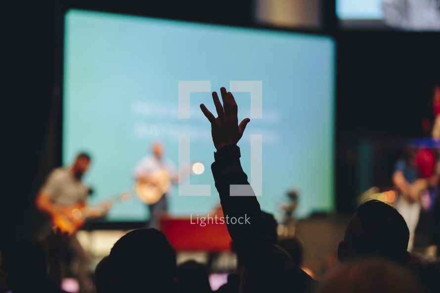 raised hands in a congregation at church 
