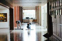 cleanup crew cleaning a lobby 
