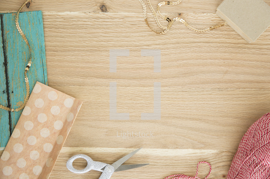 gift wrap items on wood background 