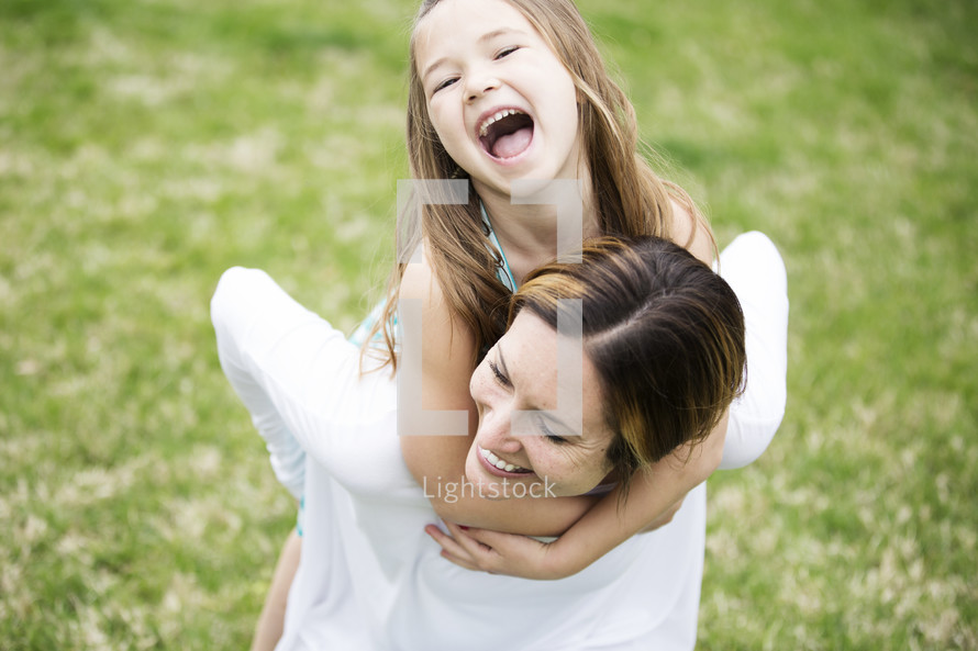 mother and daughter together outdoors 