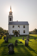 small rural white church with steeple 