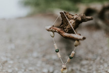 wood beads on a branch 
