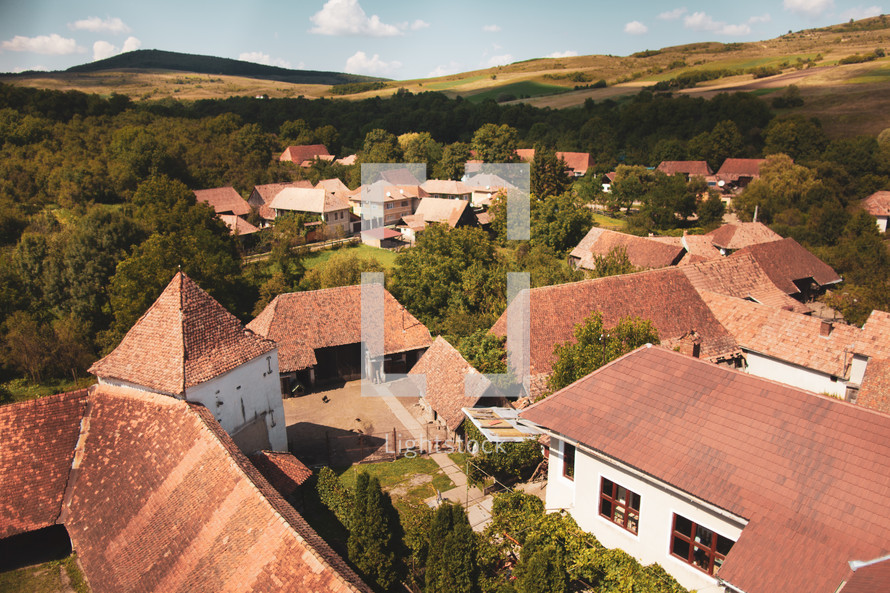 tile roofs of homes in a valley 