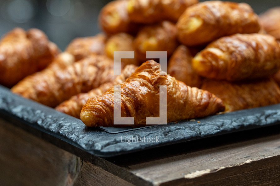 Croissant selection close-up, pastry snacks, fresh pastries, breakfast bar