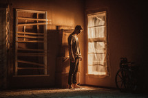 a man standing in an empty room 