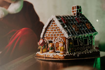Homemade sweet gingerbread house, decorated cookies. Yummy Christmas dessert. High quality photo