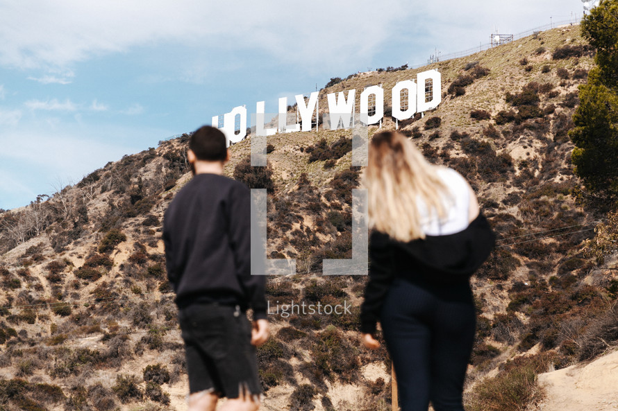 a couple looking at the Hollywood sign 