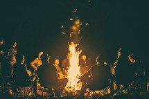 sitting around a campfire 