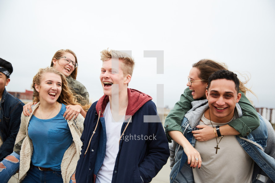 group of teens walking through a parking deck 
