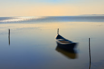 Long exposure Boat In The Calm Water on Razim Lake, Romania