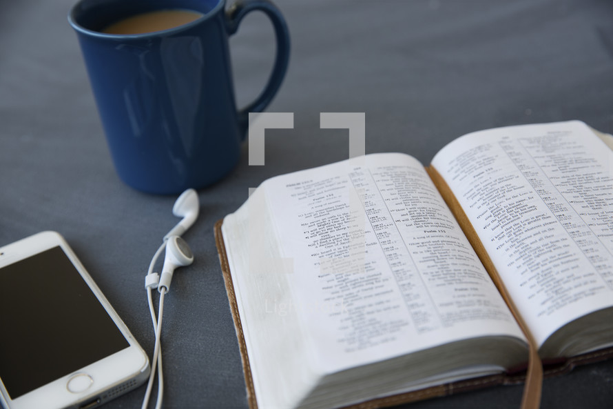 ipod, earbuds, open Bible, reading, podcast, coffee, coffee mug