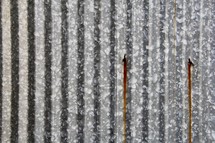 rust from nails on corrugated metal 