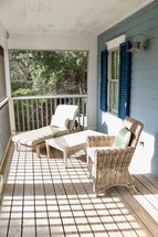 wicker furniture on a porch 