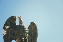 top of a flag - Statute of eagle with wings spread