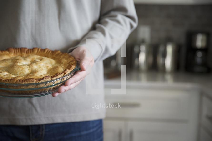 a man holding a pie 