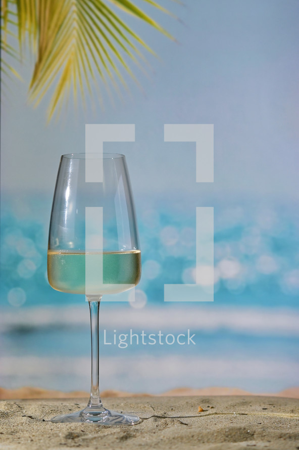 Closeup Summer White Wine Glass on Beach