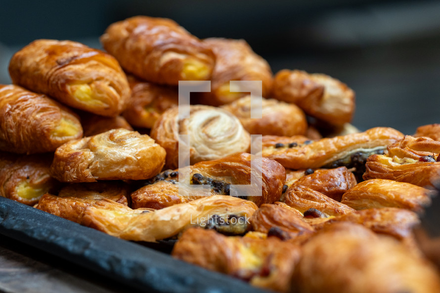 Selection of pastries, pastry snacks, croissant, pain au chocolat, cakes and dessert