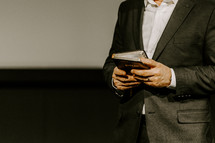 Pastor with a Bible in his hand during a sermon.