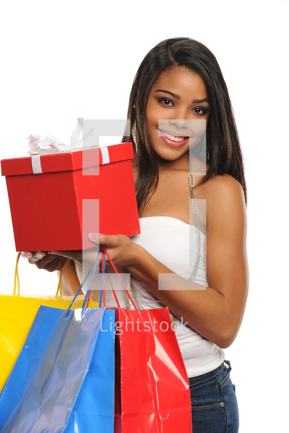 female shopper holding a gift box and shopping bags 