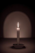flame on a white candle stick 