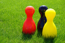 bowling pins in grass 