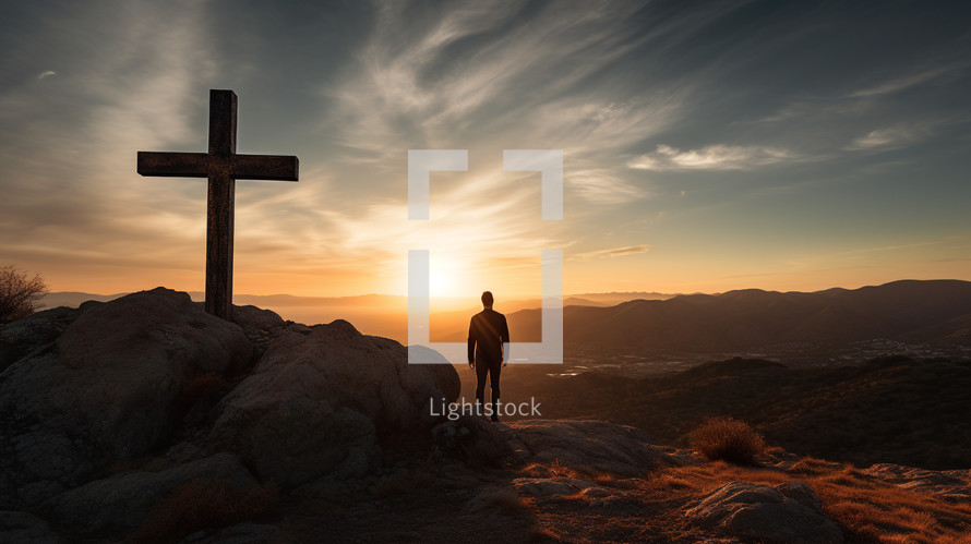 A man standing by a cross thinking at sunset. 
