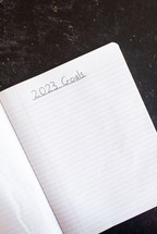 Blank notebook paper with 2023 Goals written on it