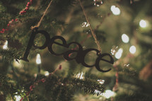 A peace ornament on the Christmas tree