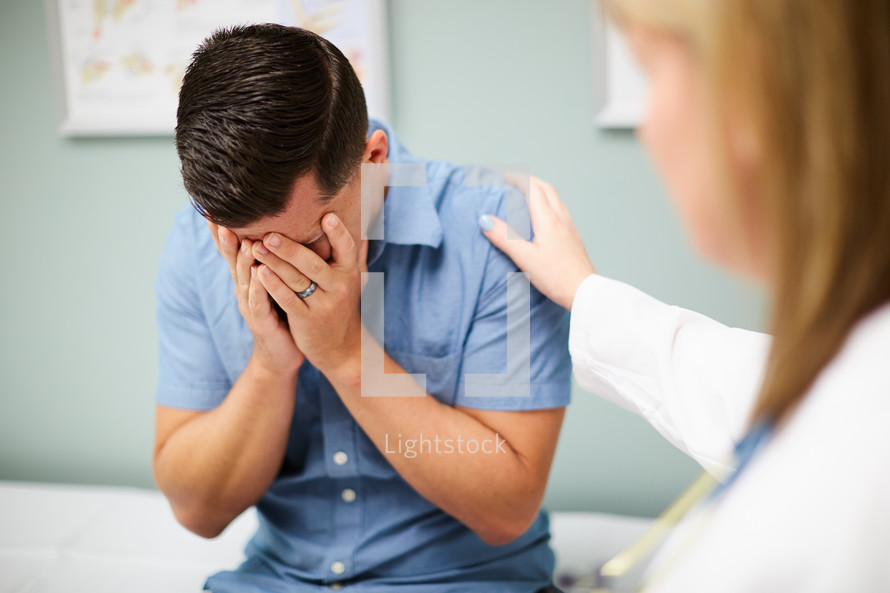 a man at the doctor's office getting bad news 