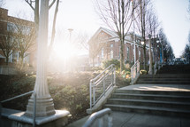 sunburst and concrete steps on a college campus 